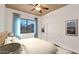 Cozy bedroom with ceiling fan, large window, and closet with sliding doors at 40108 N 2Nd Way, Phoenix, AZ 85086