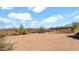 Open carport on a desert property with views of cacti and mountains in the distance at 40108 N 2Nd Way, Phoenix, AZ 85086