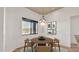 Cozy dining area with natural light, a modern chandelier, and tranquil desert views at 40108 N 2Nd Way, Phoenix, AZ 85086