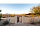 Metal gate entrance to the property with desert landscape views at 40108 N 2Nd Way, Phoenix, AZ 85086