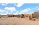Exterior of the custom home with a detached garage and beautiful desert landscape at 40108 N 2Nd Way, Phoenix, AZ 85086