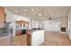 Bright, open kitchen with modern cabinetry, granite counters, stainless steel appliances, and seamless flow to living area at 40108 N 2Nd Way, Phoenix, AZ 85086