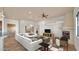 Bright and airy living room featuring a cozy fireplace, neutral tones, and comfortable seating arrangement at 40108 N 2Nd Way, Phoenix, AZ 85086