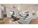 Open-concept living room featuring a fireplace, seamless flow to the kitchen, and comfortable seating area at 40108 N 2Nd Way, Phoenix, AZ 85086