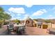 Outdoor kitchen featuring a pizza oven, grill, and dining area, perfect for entertaining with desert views at 40108 N 2Nd Way, Phoenix, AZ 85086