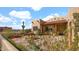 Outdoor patio area featuring a water fountain, desert landscaping, and a mountain view at 40108 N 2Nd Way, Phoenix, AZ 85086