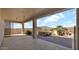 A covered patio with a hot tub and a built-in grill overlooks the desert landscape and offers shade at 40108 N 2Nd Way, Phoenix, AZ 85086