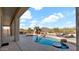 Kidney-shaped pool with built-in table, surrounded by lush landscaping and offering stunning desert views at 40108 N 2Nd Way, Phoenix, AZ 85086