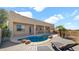 Enjoy a kidney-shaped pool with a wood deck, lounge chairs, and a desert view at this beautiful home at 40108 N 2Nd Way, Phoenix, AZ 85086