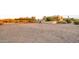 Custom home, carport, and desert landscaping on the property at sunset at 40108 N 2Nd Way, Phoenix, AZ 85086