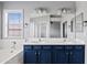 Bright Primary bathroom with double sinks, separate tub, and neutral tile at 4098 E Rustler Way, Gilbert, AZ 85297