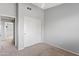 Bedroom with neutral carpet, gray walls, closet with sliding doors, ceiling fan at 4098 E Rustler Way, Gilbert, AZ 85297