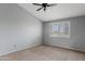 Neutral bedroom featuring a vaulted ceiling and large window at 4098 E Rustler Way, Gilbert, AZ 85297
