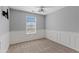 Bedroom with natural light from a window, carpet, gray walls, and decorative white trim at 4098 E Rustler Way, Gilbert, AZ 85297