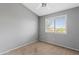 Bedroom featuring natural light from window, neutral carpet, and gray walls at 4098 E Rustler Way, Gilbert, AZ 85297