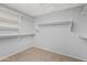 Walk-in closet with shelving and hanging space; carpeted floor at 4098 E Rustler Way, Gilbert, AZ 85297