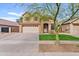 Charming two-story home showcasing a well-manicured front lawn and welcoming curb appeal at 4098 E Rustler Way, Gilbert, AZ 85297