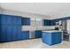 Modern kitchen featuring navy blue cabinets, stainless steel appliances, and a functional island at 4098 E Rustler Way, Gilbert, AZ 85297