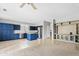 Spacious living room and kitchen with a large built-in entertainment center at 4098 E Rustler Way, Gilbert, AZ 85297