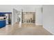 Open-concept living room with built-in shelves and adjacent blue kitchen at 4098 E Rustler Way, Gilbert, AZ 85297