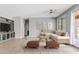 Spacious living area featuring a cozy sectional sofa, tile flooring, and sliding glass doors at 4098 E Rustler Way, Gilbert, AZ 85297