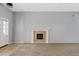 Spacious living room features neutral walls, plush carpet and a fireplace, creating a cozy atmosphere at 4098 E Rustler Way, Gilbert, AZ 85297