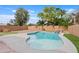 Backyard pool with desert landscaping and privacy wall at 4098 E Rustler Way, Gilbert, AZ 85297