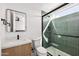 Contemporary bathroom with tile shower, black hardware, and stylish sink and mirror at 4318 E Cheery Lynn Rd, Phoenix, AZ 85018