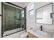 Modern bathroom with glass-enclosed shower, sleek fixtures, and contemporary vanity at 4318 E Cheery Lynn Rd, Phoenix, AZ 85018