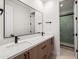 Modern bathroom with double sinks, quartz countertop, and sleek black hardware at 4318 E Cheery Lynn Rd, Phoenix, AZ 85018