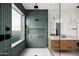 Bathroom features a walk-in shower, built-in niche, and sleek vanity with white countertop at 4318 E Cheery Lynn Rd, Phoenix, AZ 85018