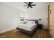 Well-lit bedroom with a comfortable bed, side tables, and built in wardrobe storage at 4318 E Cheery Lynn Rd, Phoenix, AZ 85018
