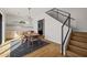 Dining area features modern lighting, wood floors, and adjacent stairway at 4318 E Cheery Lynn Rd, Phoenix, AZ 85018