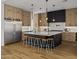 Bright modern kitchen with stainless steel appliances, center island, and hardwood floors at 4318 E Cheery Lynn Rd, Phoenix, AZ 85018
