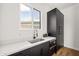 Kitchenette with stainless steel sink, white countertop, dark cabinets, and microwave at 4318 E Cheery Lynn Rd, Phoenix, AZ 85018