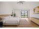 Spacious main bedroom with hardwood floors, a ceiling fan, and access to the pool at 4318 E Cheery Lynn Rd, Phoenix, AZ 85018