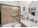 Bathroom with a shower and vanity with dark hardware at 4710 E Tierra Buena Ln, Phoenix, AZ 85032