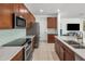 Modern kitchen showcasing stainless steel appliances, granite countertops, and stylish backsplash at 4710 E Tierra Buena Ln, Phoenix, AZ 85032