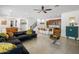 Open concept living room with tile floors, plush seating, and seamless transition to the kitchen at 4710 E Tierra Buena Ln, Phoenix, AZ 85032