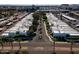 Aerial view of the neighborhood street with a roundabout and palm trees lining the street at 4836 N 72Nd Way, Scottsdale, AZ 85251