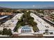 Aerial view of the community with a pool, trees, and modern white buildings at 4836 N 72Nd Way, Scottsdale, AZ 85251