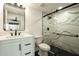 Modern bathroom featuring a glass-enclosed shower with stylish tiling and sleek fixtures at 4836 N 72Nd Way, Scottsdale, AZ 85251