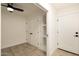 Bedroom with ceiling fan includes double door closet and a built-in wall shelf at 4836 N 72Nd Way, Scottsdale, AZ 85251