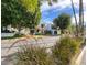 Charming white home with lush landscaping, a terracotta roof, and a picturesque view at 4836 N 72Nd Way, Scottsdale, AZ 85251