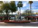 Charming view of the Scottsdale Horse Fountain with bright flowers and palm trees at 4836 N 72Nd Way, Scottsdale, AZ 85251