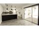 Bright and modern kitchen with white cabinets and a sliding glass door to the outside at 4836 N 72Nd Way, Scottsdale, AZ 85251