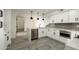 Well-lit kitchen features a breakfast bar, stainless dishwasher, stainless appliances, grey tile backsplash and stone countertops at 4836 N 72Nd Way, Scottsdale, AZ 85251