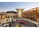 Upscale shopping center featuring modern architecture, valet service, and pedestrian walkways at 4836 N 72Nd Way, Scottsdale, AZ 85251