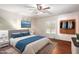 Bedroom features a comfortable bed, built-in closet, and stylish decor, creating a relaxing space at 4855 W Turquoise Ave, Glendale, AZ 85302