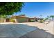 Charming single-story brick home featuring a well-manicured lawn, desert landscaping and a spacious two-car garage at 4855 W Turquoise Ave, Glendale, AZ 85302